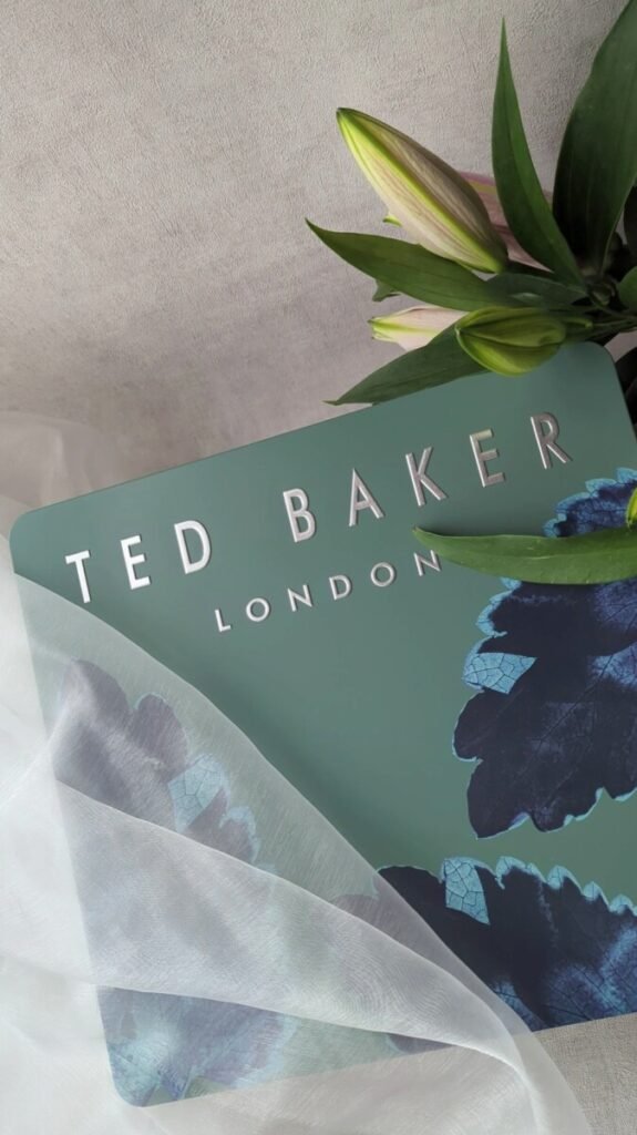 Close-up of Ted Baker Advent Calendar for Men 2025 showcasing elegant green tin with gold detailing and Ted Baker branding.